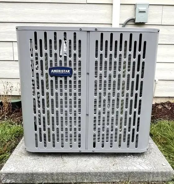 Ameristar outdoor air-conditioning unit beside a home
