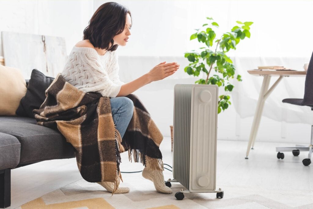 imgi_120_attractive-young-woman-with-blanket-in-cold-room-with-heater | Breeze Heating Air & Electrical Heating, AC & Electrical