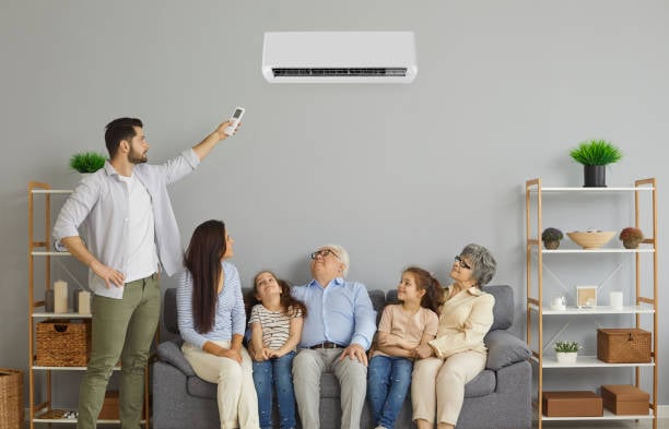 Family looking at air conditioner for potential Emergency Heating solution, ensuring home comfort with modern climate control technology.