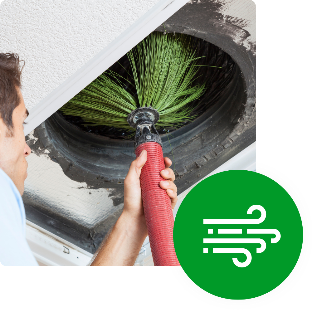 Man cleaning air duct with brush, home indoor air quality service for healthier living, Seattle, WA, ensures clean air in your home.