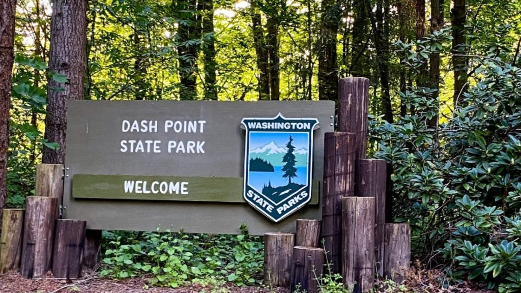 Dash Point State Park entrance sign in Federal Way location. Welcome to Washington State Parks. Explore nature near Seattle, WA, today!
