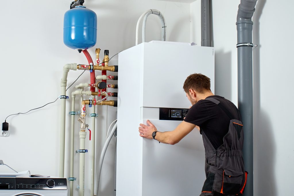 Technician inspecting a SPAN Panel, ensuring optimal performance. SPAN Panel: advanced energy management for modern homes. Seattle, WA.